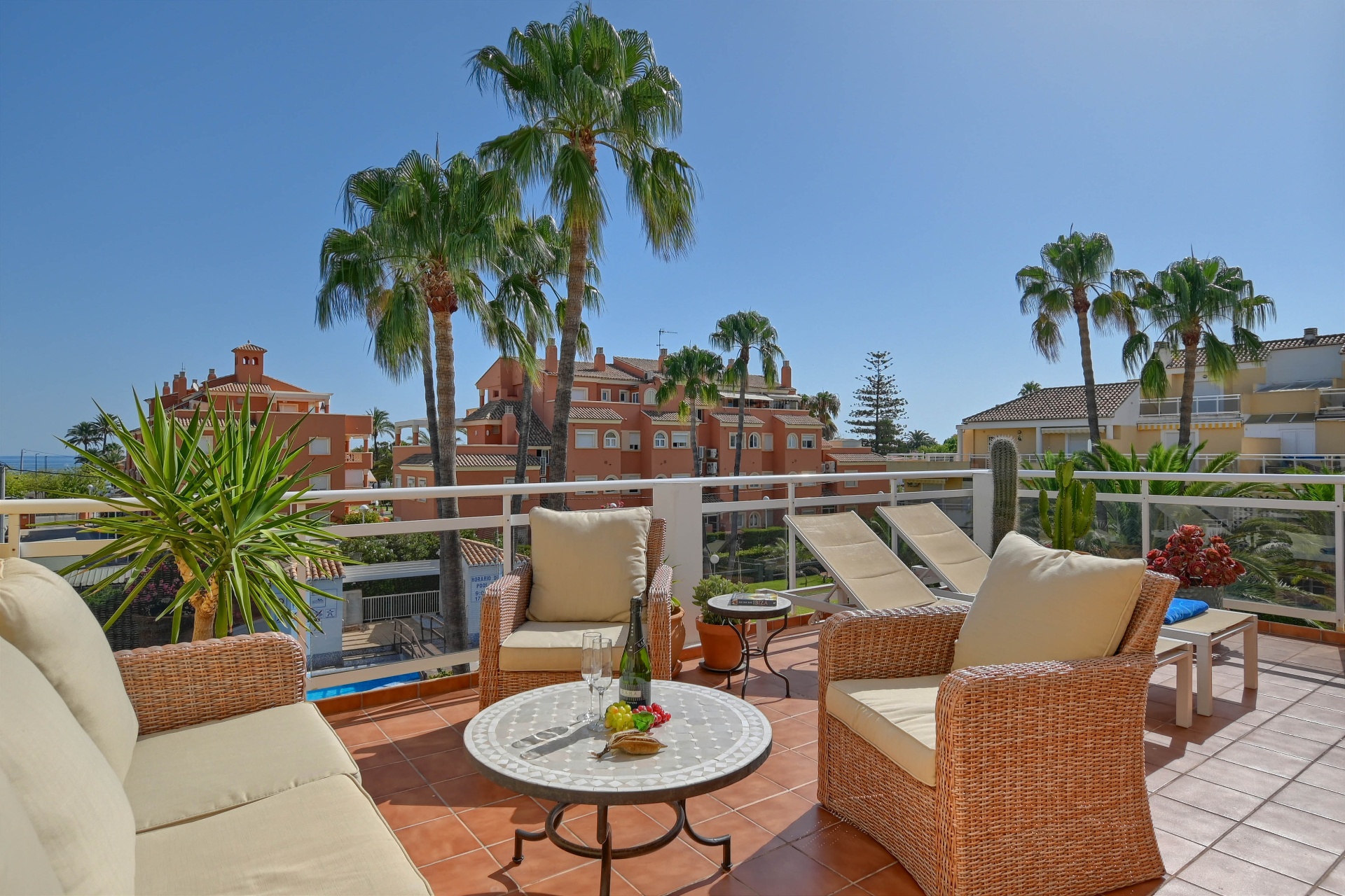 Terrace lounge with pool and sea view